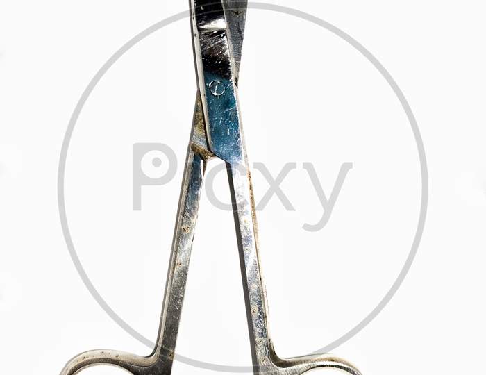 Close Up Shot Of A Small Scissor Isolated On A White Background