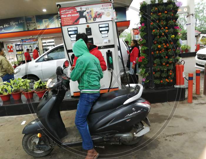 A man taking petrol from petrol station