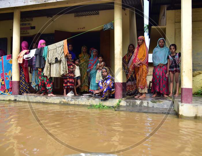 Villagers take shelter at a school which has been converted into a flood-relief camp in Madhab Para village in Nagaon, Assam on July 22, 2020