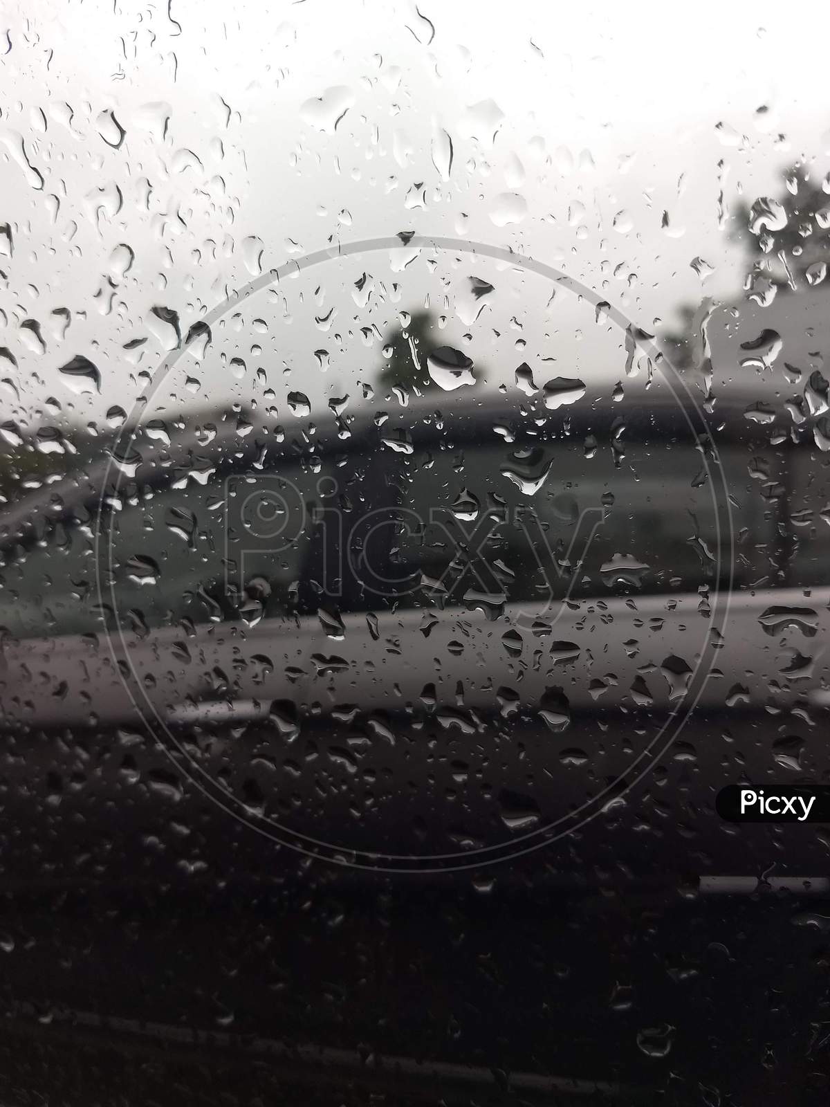 Rain drops on car window.