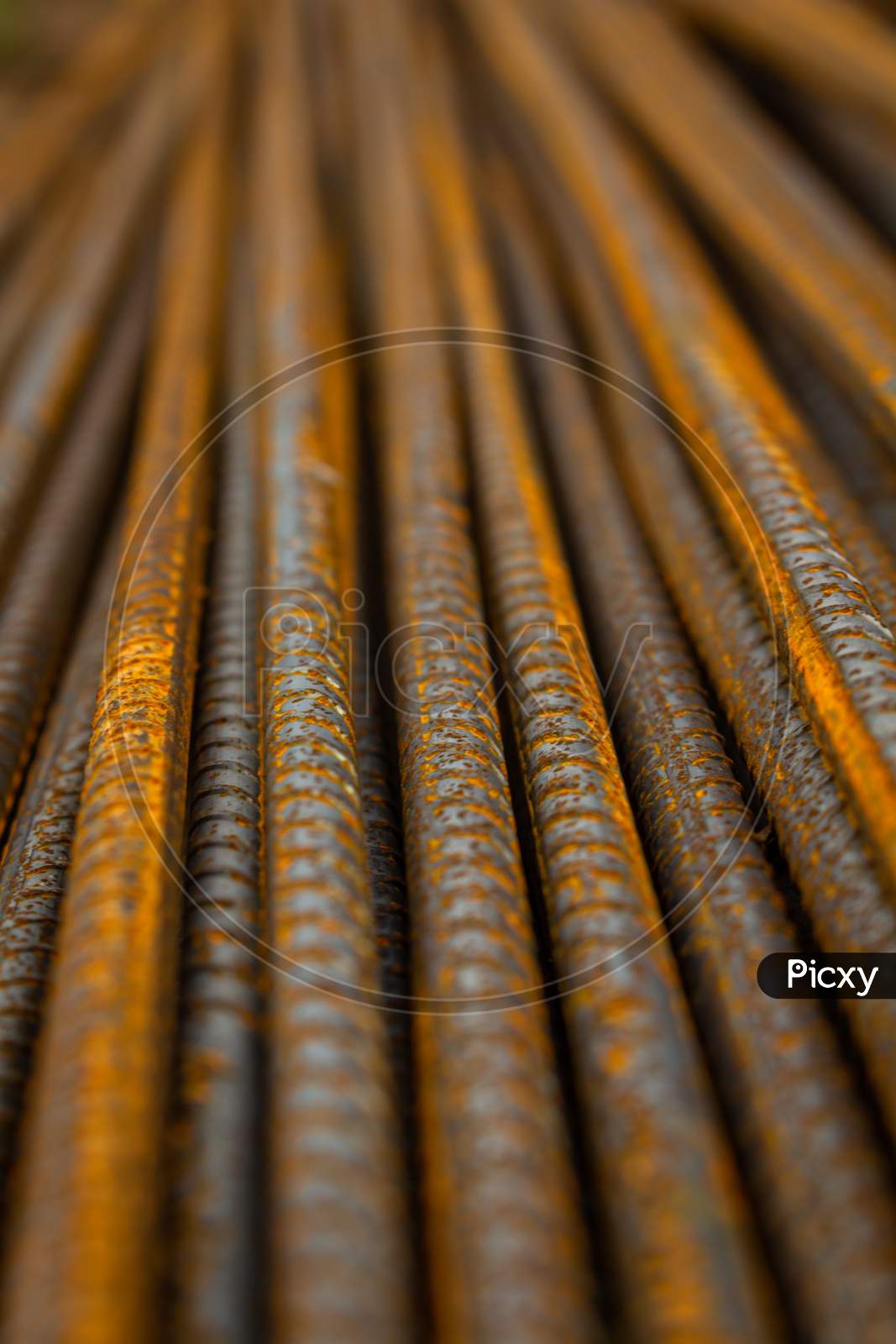 Steel Rods For Construction. Metal Used To Make Columns. Metal With Reddish Rust Stains. Background For Designers.