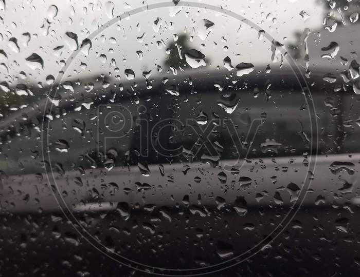 Rain drops on car window.