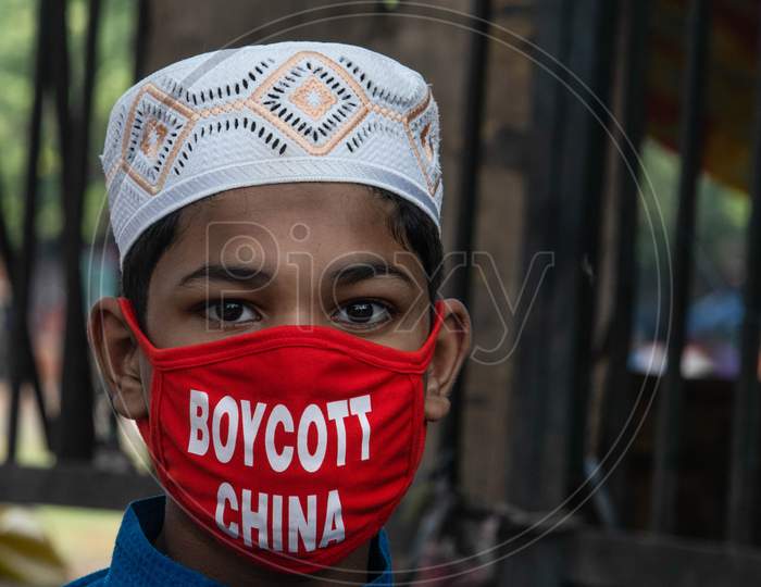 A Boy Wears A Facemask With A "Boycott China" Message at The Old Quarters Of New Delhi On July 23, 2020.