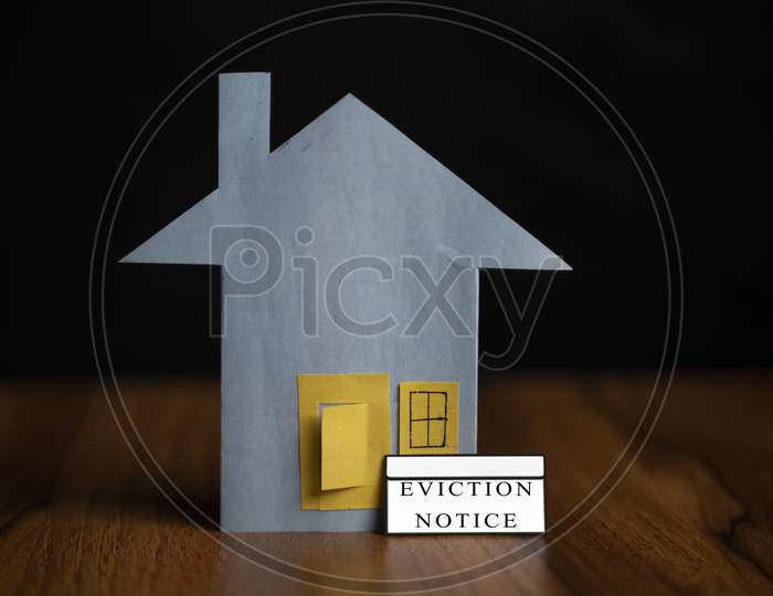 Eviction Notice Sticker Infront Of Door - Concept Showing Of Tenant Foreclosure Or Rent Pending On Black Background.