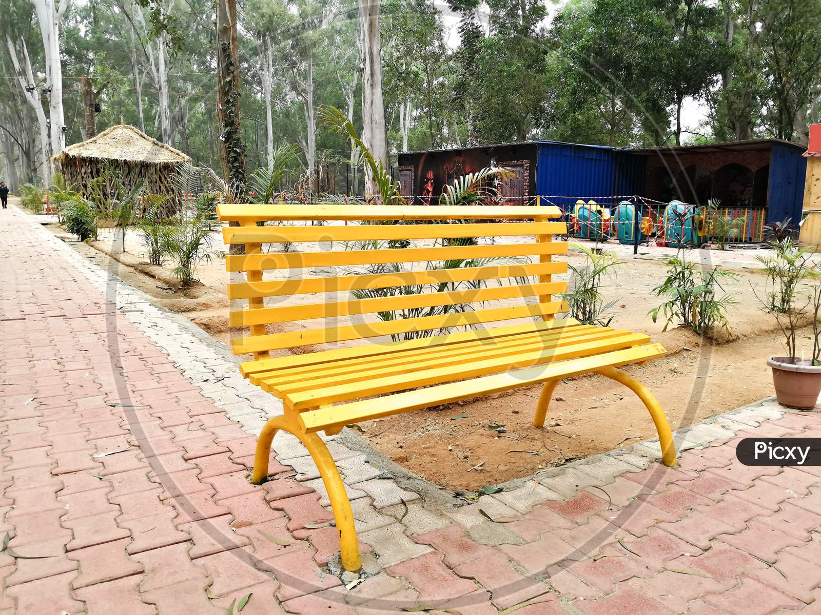 Yellow bench in park for people sitting