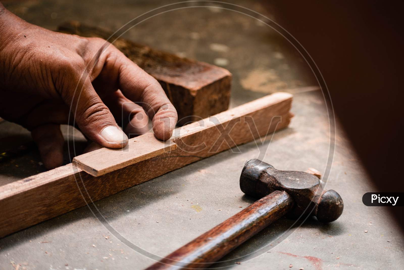 A Mechanic Does Carpenter Jobs With Wood, Saw, Hammer, Nail, Plus And Other Tools
