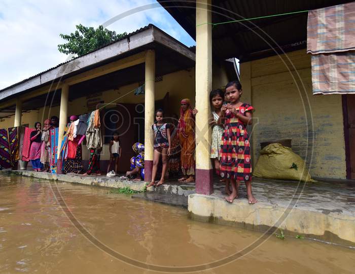 Villagers take shelter at a school which has been converted into a flood-relief camp in Madhab Para village in Nagaon, Assam on July 22, 2020