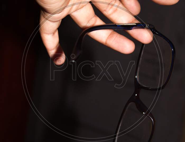 Optical on hand with dark background