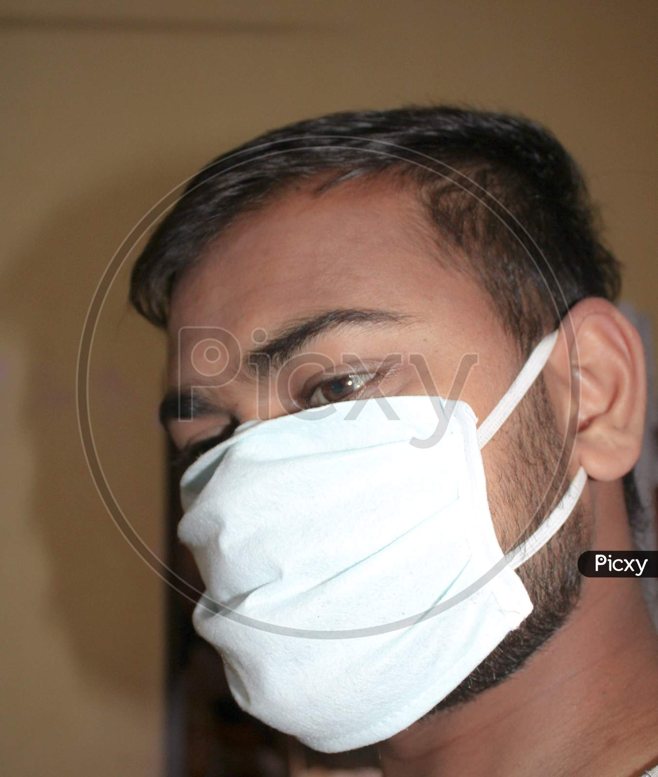 Indian man wearing mask for protection of viruses