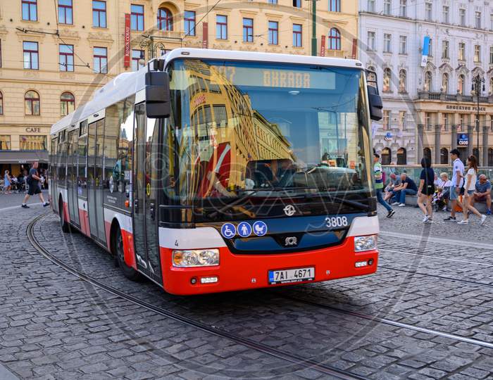 A Modern Bus Rounds A Corner On The Cobbled Streets Of The Old Town District Of Prague