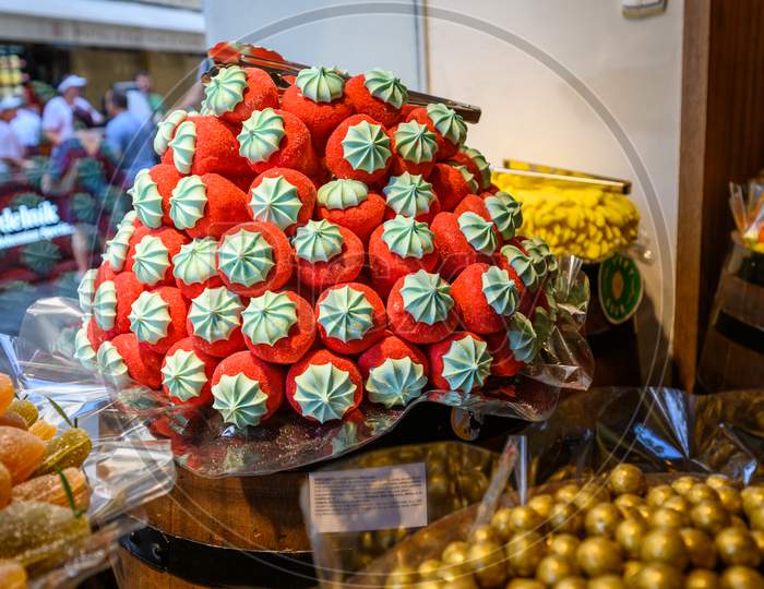 A Selection Of Sweet Candy Confectionery Stacked Up And Ready For Sale In A Shop Window