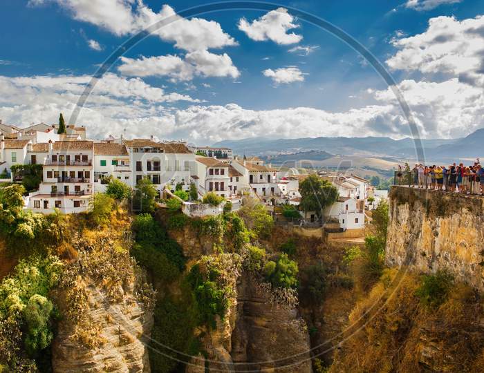 Ronda, Spain - September 06, 2015: Wide Angle View Of Famous Ronda Village Situated Solely On Mountaintop Against Dramatic Clouds