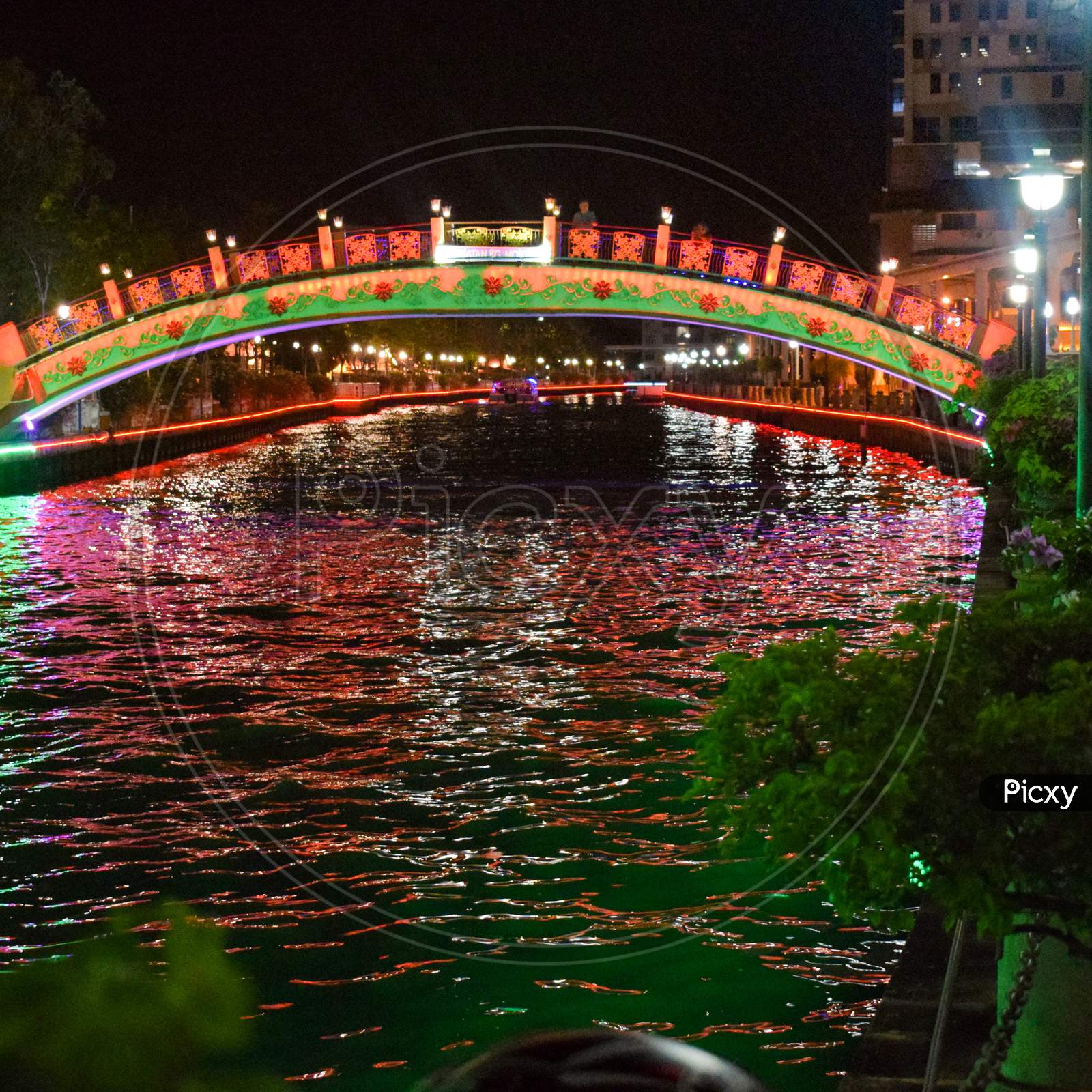 View of Malacca River at night, a popular nightlife spot with bars and music which is beautifully lit up, Night view of the Malacca River in Malacca (Melaka), Malaysia