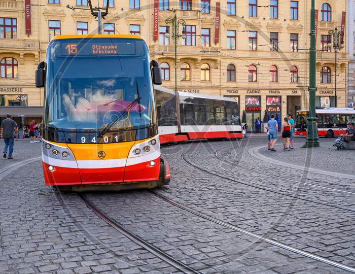 A Modern Electric Tram Rounds A Corner On The Cobbled Streets Of The Old Town District Of Prague