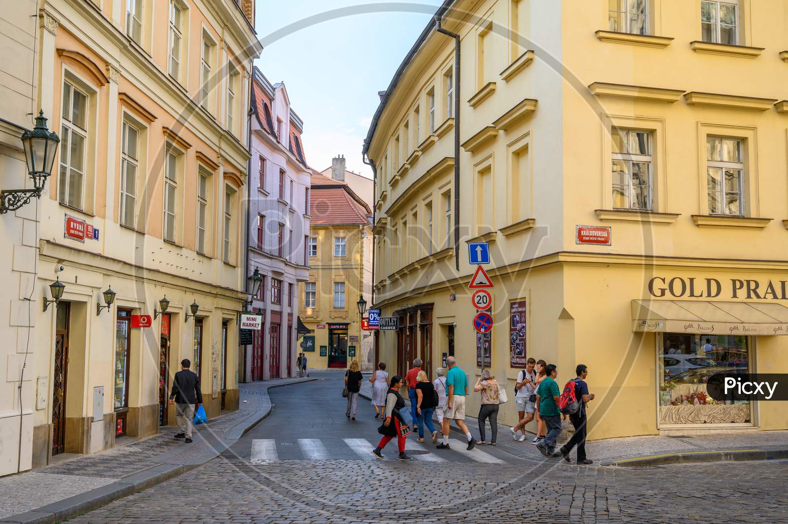 Image of Tourists Exploring The Old Streets Lined With Beautiful Buildings  In Prague, Czech Republic-IL343675-Picxy