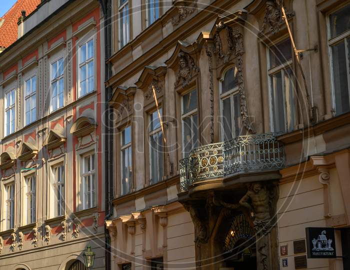 A Sunlit Balcony On The Side Of Old Buildings In Prague, Czech Republic