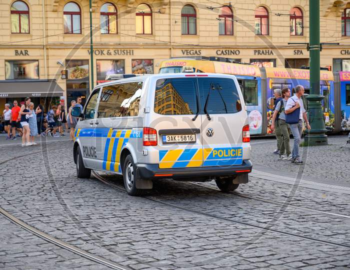 A Police Van On Tramlines And The Cobbled Streets Of The Old Town District Of Prague