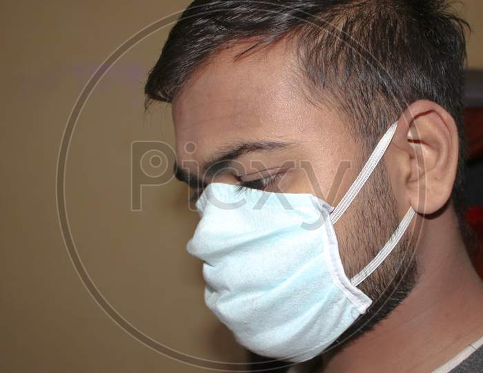 Indian man wearing mask for protection of viruses