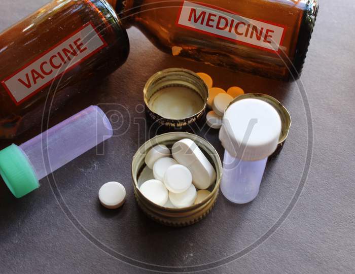 Medicine written container and tablets, pills together as pharmacy and medical theme background.