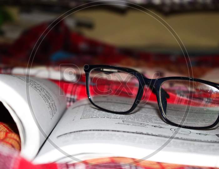Eye Optical on book with dark background