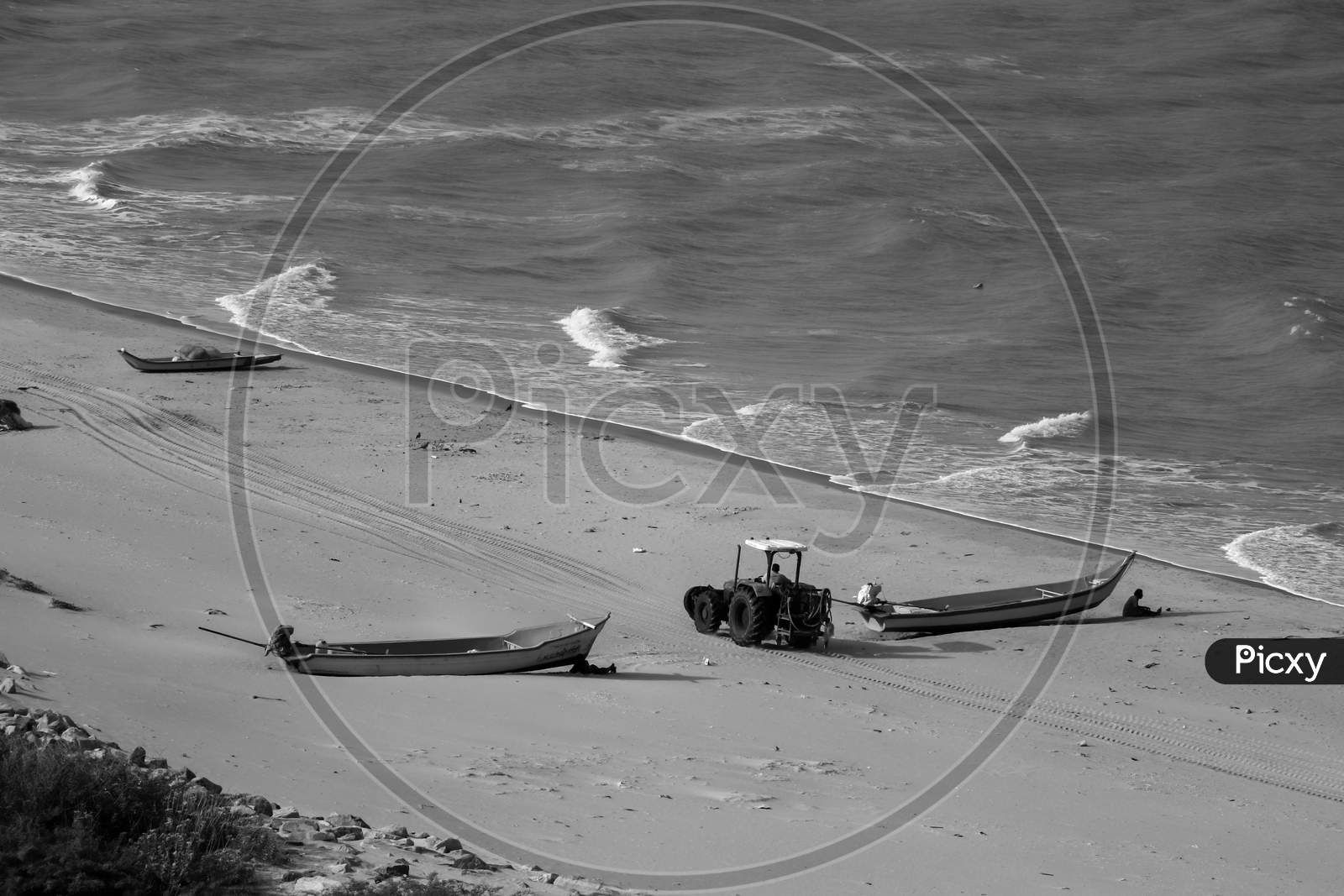 Boat tractor on beach