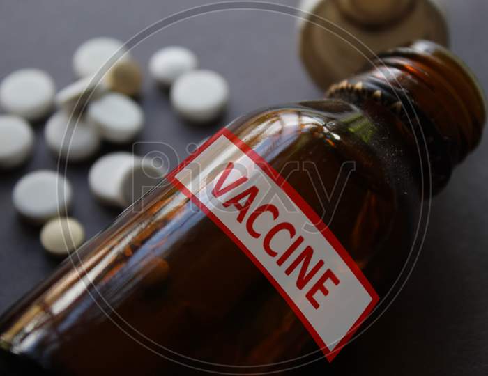 Vaccine written containers and pharmacy and medical theme background.
