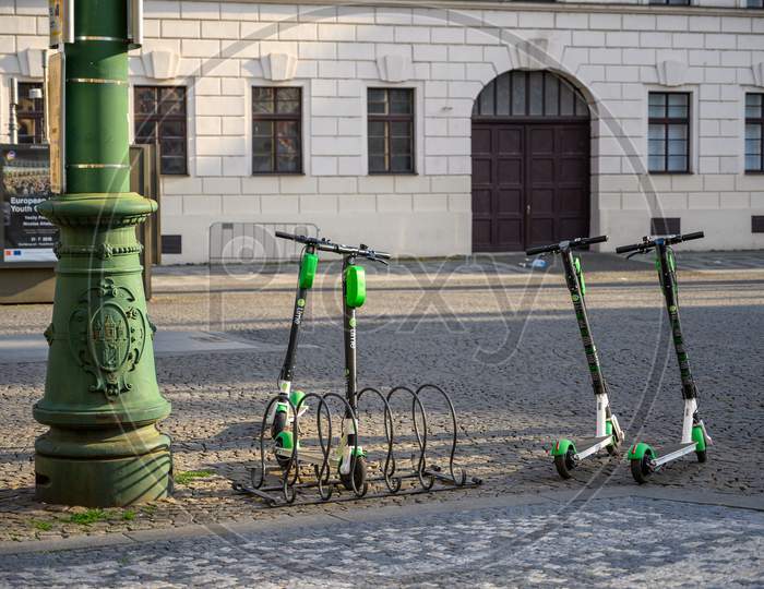 Electric Rental Scooters Parked On The Cobbled Streets Of The Old Town District Of Prague