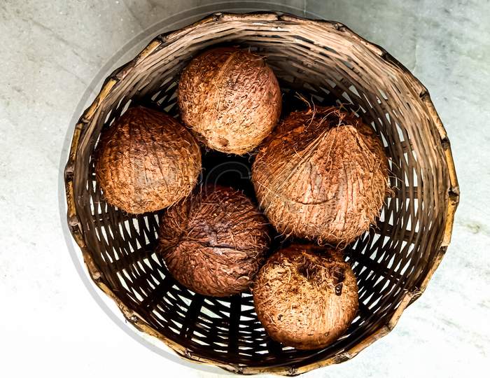 Indian fresh coconut in the basket for sell.