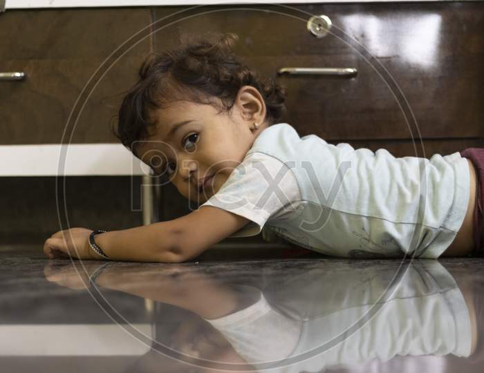 The Image Of A Little Boy Showing On A Transparent Marble Stone