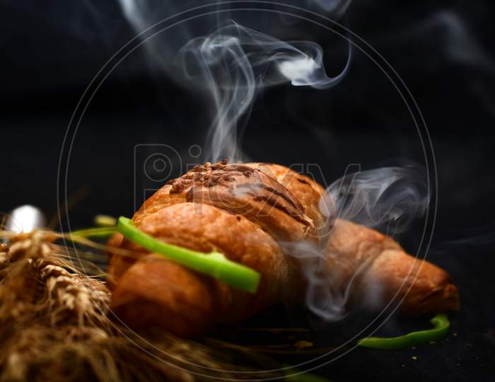 Hot Chilli Bread With Smoke On Black Background.
