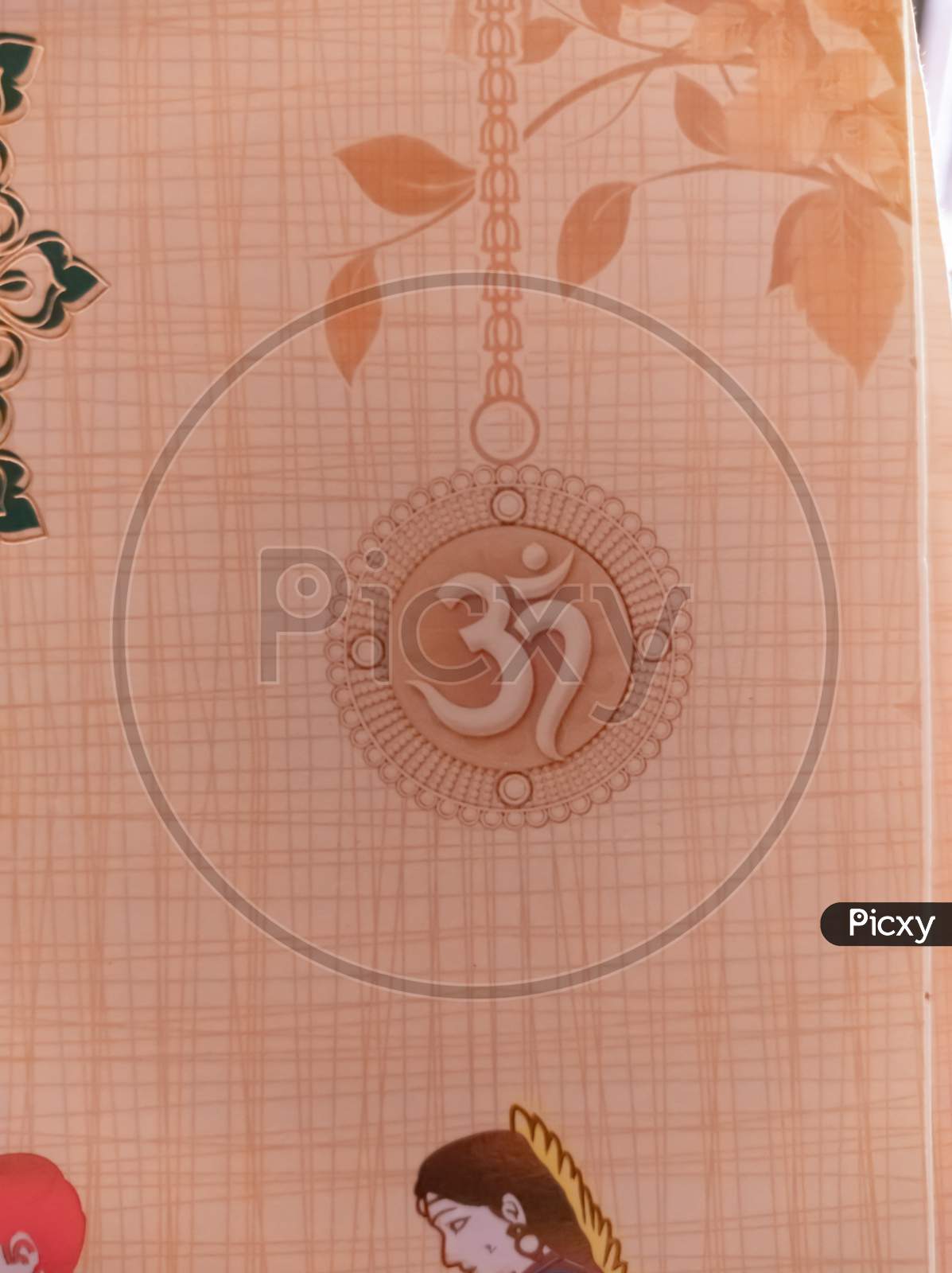 Indian traditional ohm symbol on wedding invitation card.