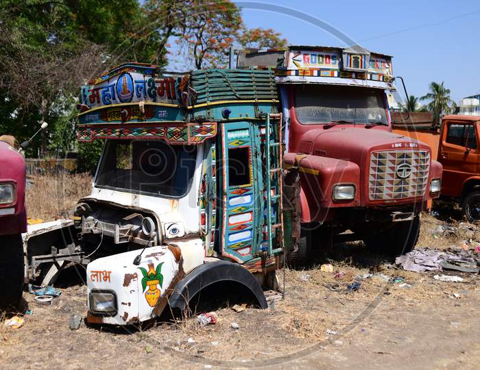 Old, dilapidated and rusty chassis of discarded trucks.