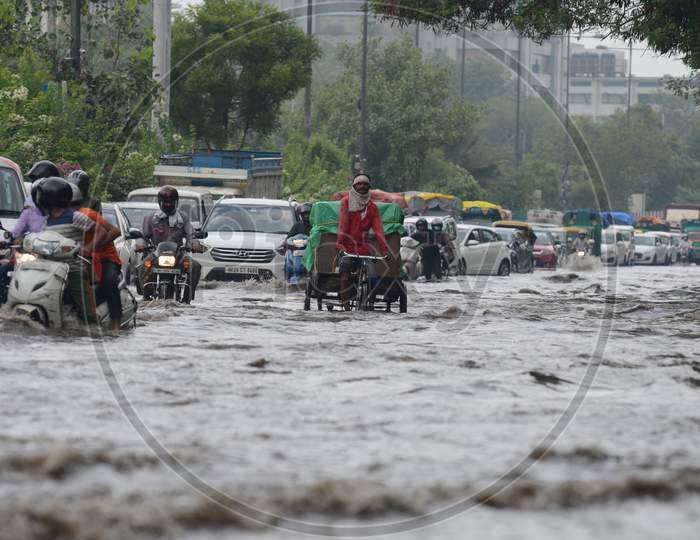 Traffic Congestion Is Seen As Commuters Get Stuck On The Water-Logged Road, Near Ito, On July 22, 2020 In New Delhi, India.