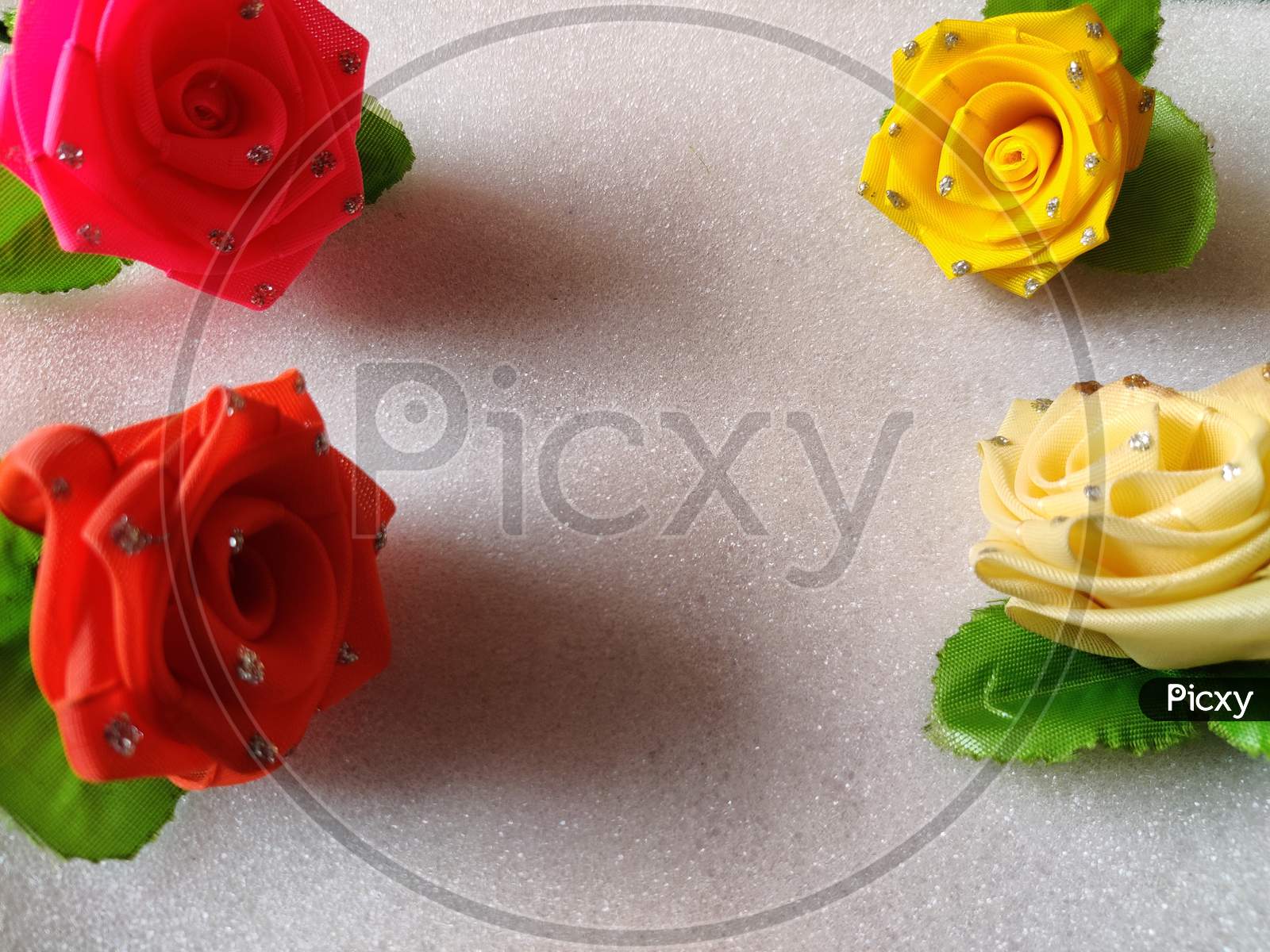 Yellow,Red,Pink,White Roses Are Kept In White Background. Can Be Used For Copy Space, Advertisements.