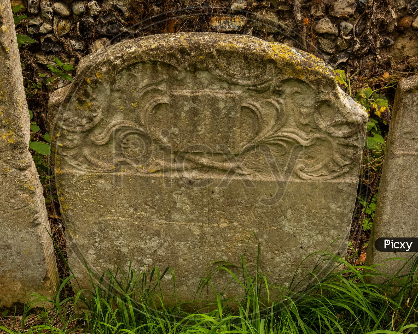 Old Ornate Weathered Gravestone In English Cemetery