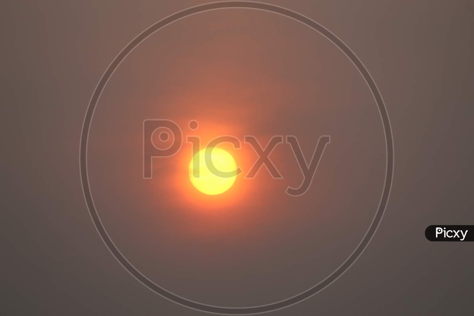 Beautiful Red yellow bright Sun display with large orange sky background, sunset time.