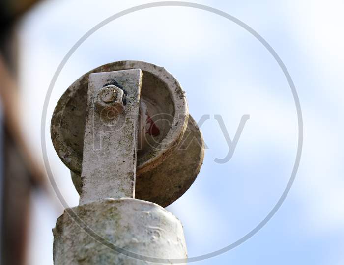 Low Angle Shot Of An Old Well Pulley Against Sky, Vintage