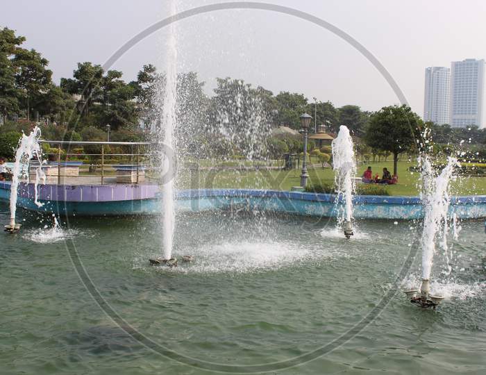 Water fountain and water lake partial display with selective focus at Eco Park, Rajarhat, Kolkata, a famous public tourist spot.