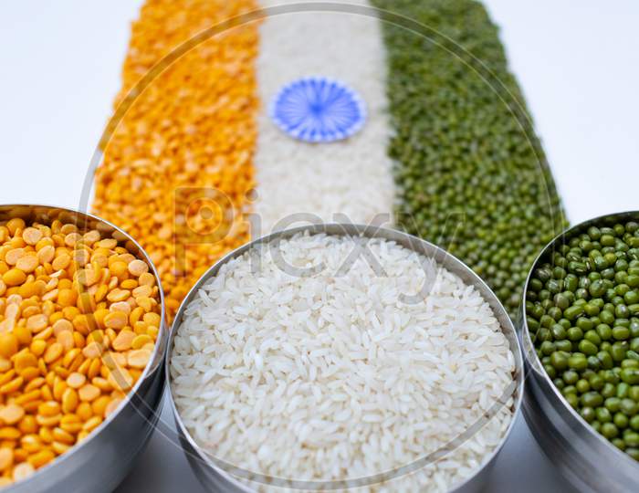 Indian flag, tiranga, tricolor, made with arhar dal, rice and moong dal, bowl, top view, triangular, with white background, three bowls, image