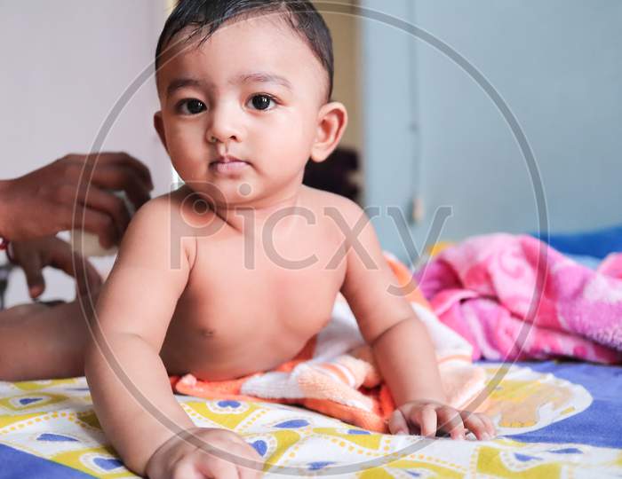 An Infant Toddler Baby Boy Wet With Foam Enjoying Shower Bathing Rubbed By Towel