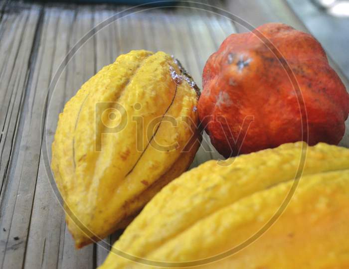 Close Up Of Cacao Fruit On A Bamboo Skin Board