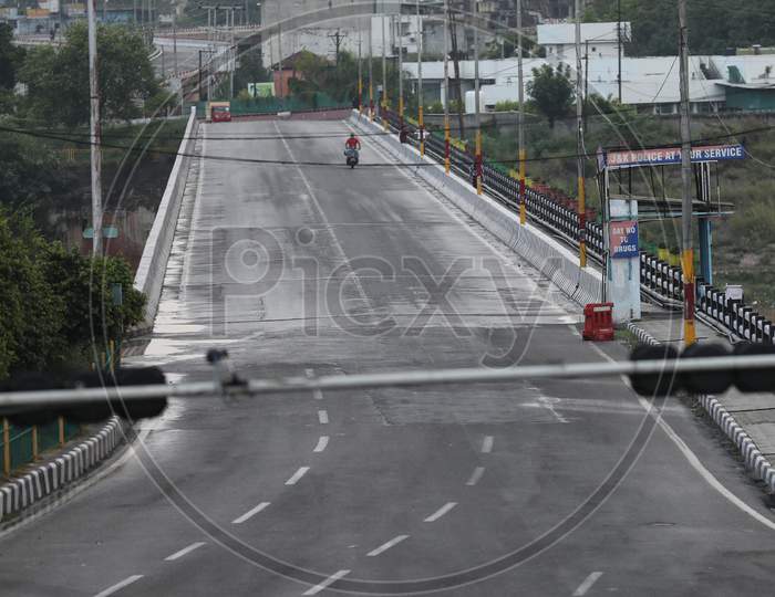 Deserted look of a road as authorities imposed weekend lockdown from 6 pm to 6 am from Friday to Monday in Jammu on July 25, 2020, to prevent the spread of Coronavirus which had witnessed a spike across Jammu and Kashmir in the recent weeks.