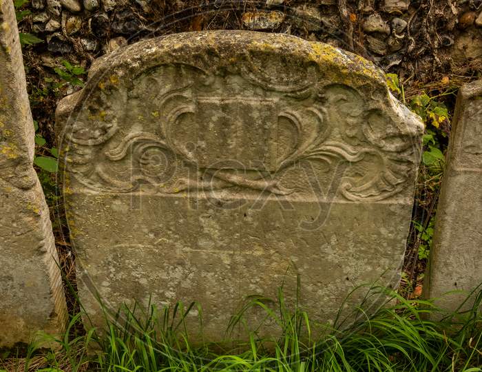 Old Ornate Weathered Gravestone In English Cemetery