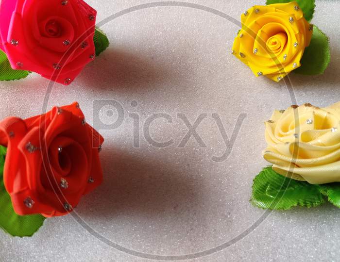 Yellow,Red,Pink,White Roses Are Kept In White Background. Can Be Used For Copy Space, Advertisements.