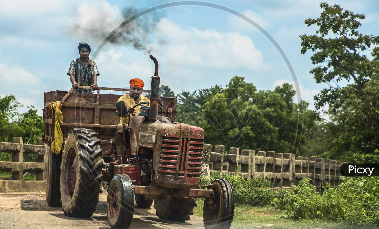 An Indian driving tractor