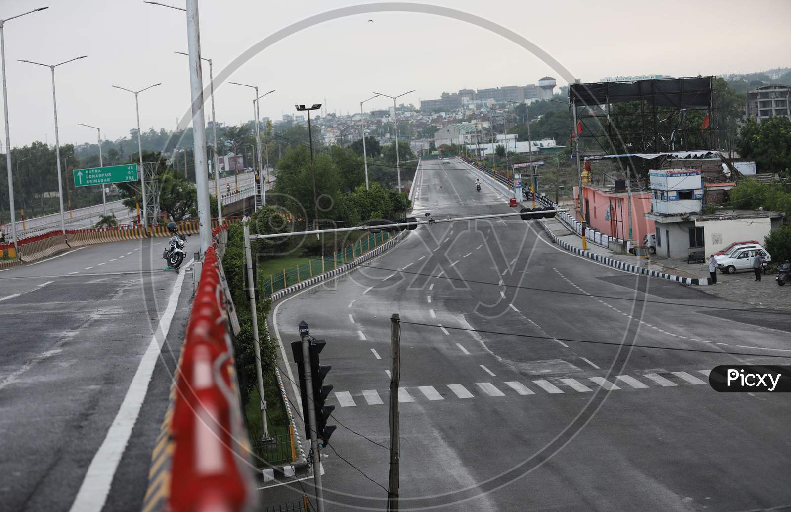 Deserted look of a road as authorities imposed weekend lockdown from 6 pm to 6 am from Friday to Monday in Jammu on July 25, 2020, to prevent the spread of Coronavirus which had witnessed a spike across Jammu and Kashmir in the recent weeks.