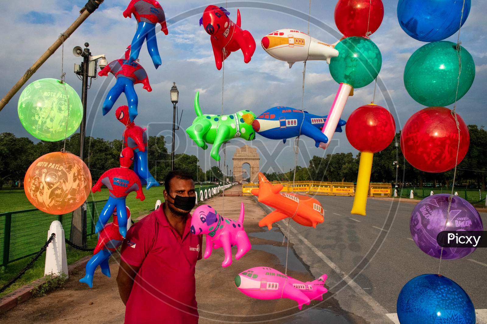 A Balloon Seller Waits For Customers Near India Gate In New Delhi, India On July 22, 2020.
