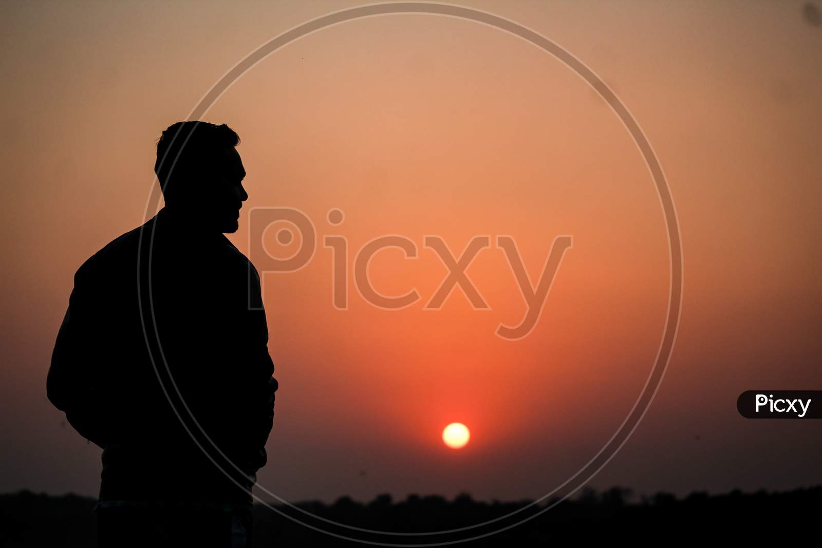 Man Looking at Sunset