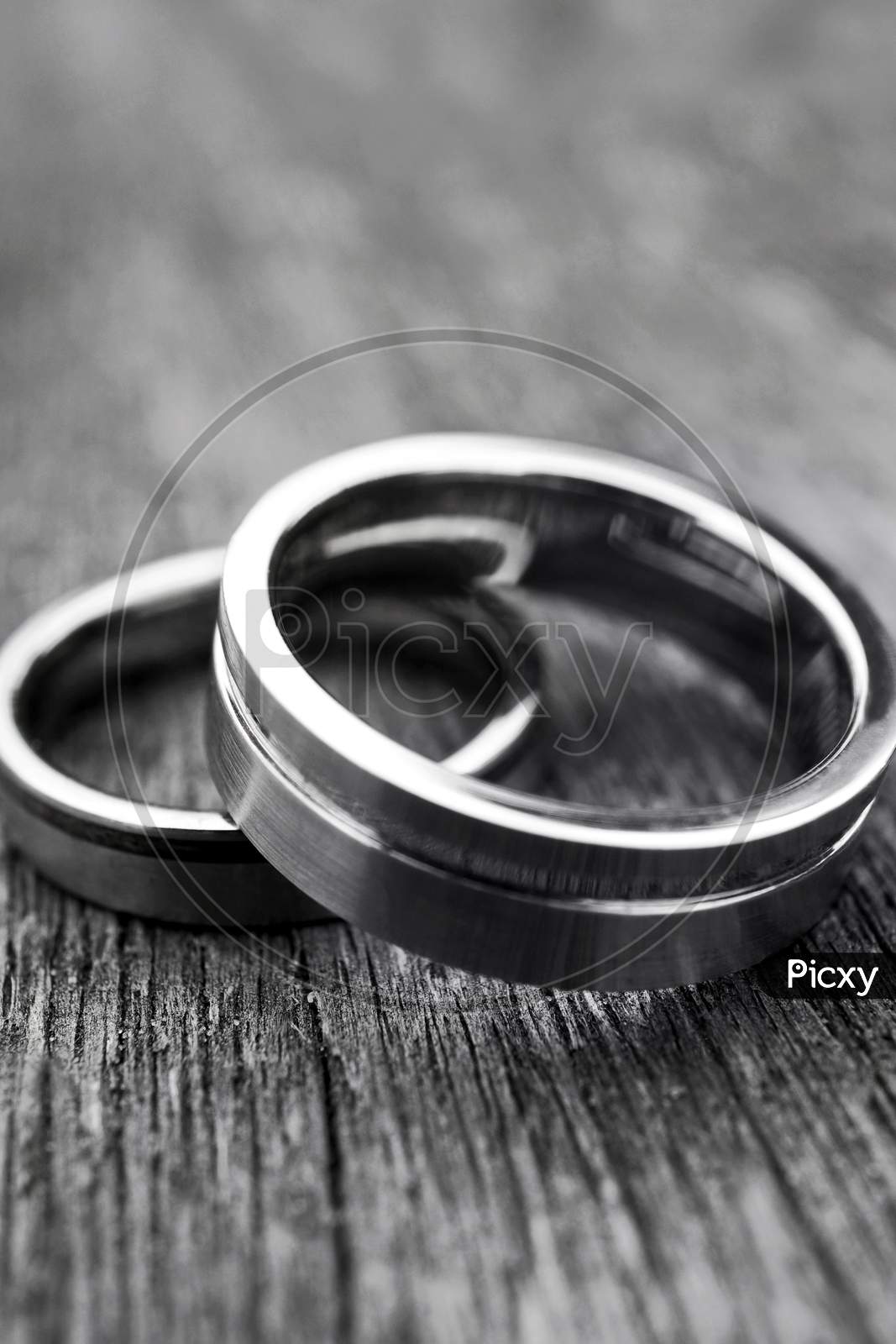 Wedding Rings On Old Wood In Black And White