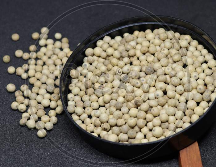 White Pepper seeds isolated on black background